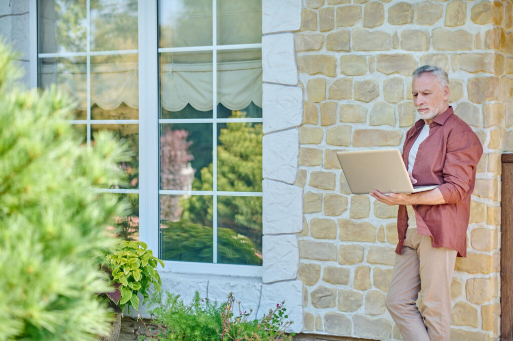 Professional demonstrating outdoor home improvement projects that add value technique